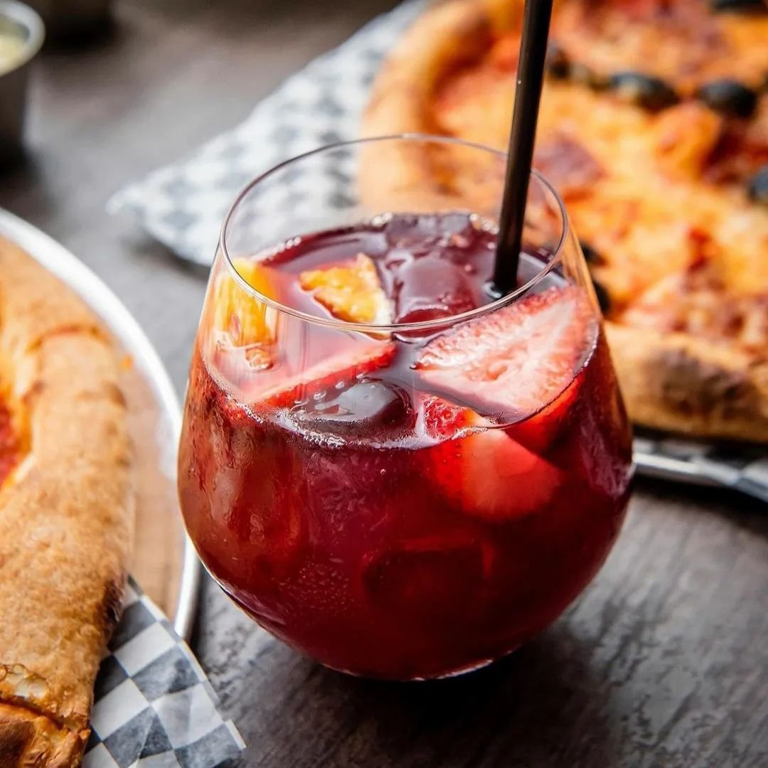 Sangria beside pizzas at an FBI Pizza event