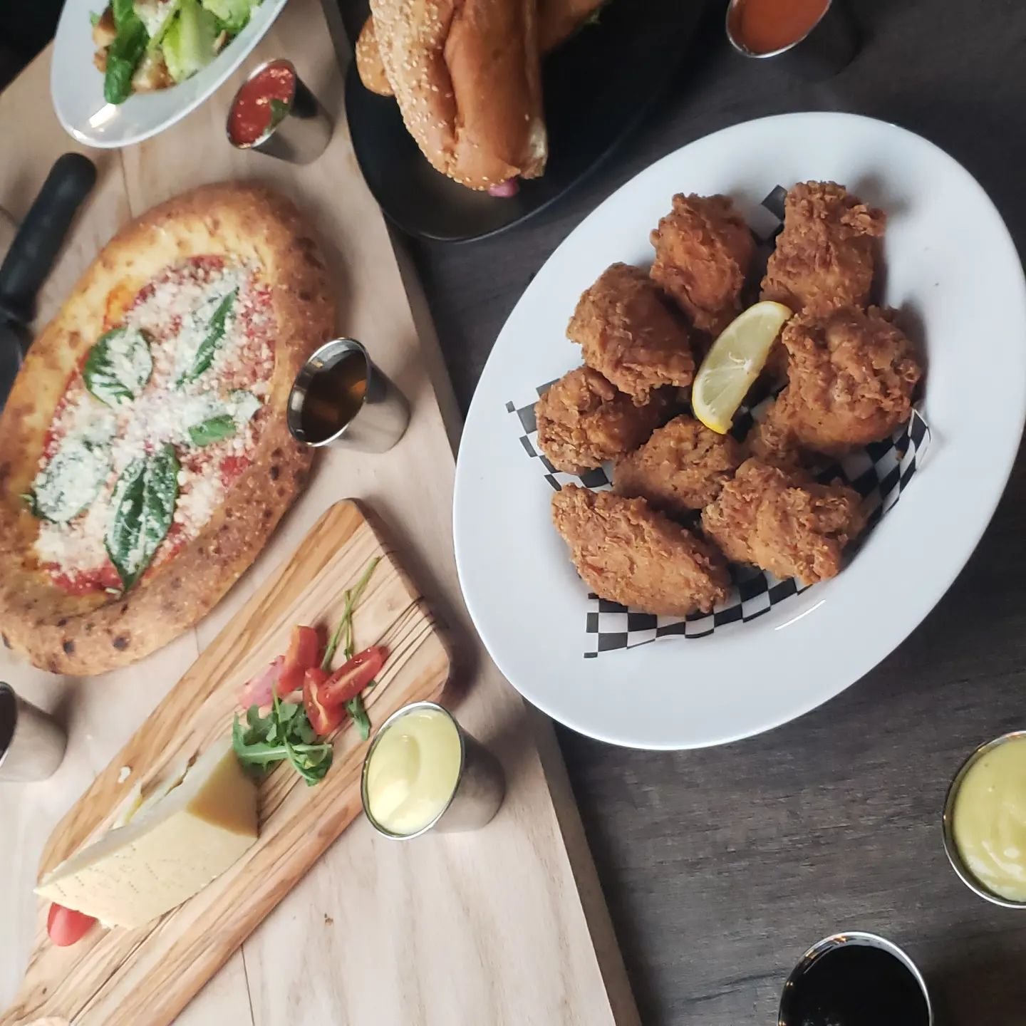 FBI Pizza catering spread with panzerotti, fried chicken, hoagies and sides